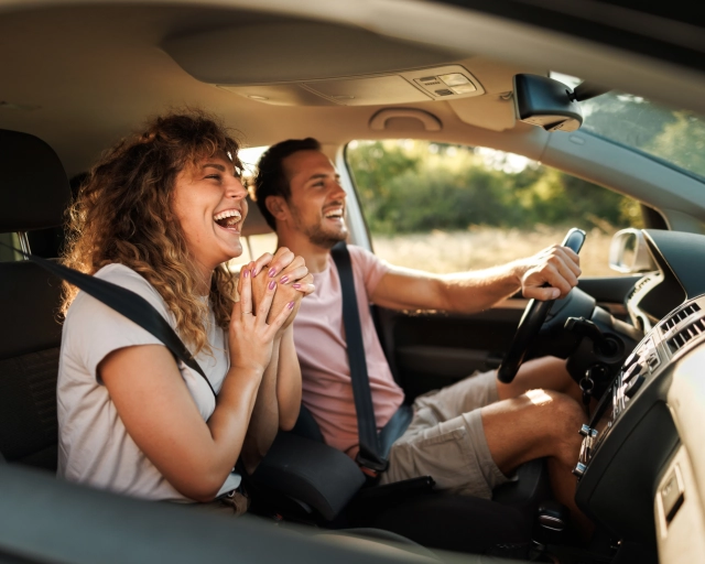 couple having fun in a car
